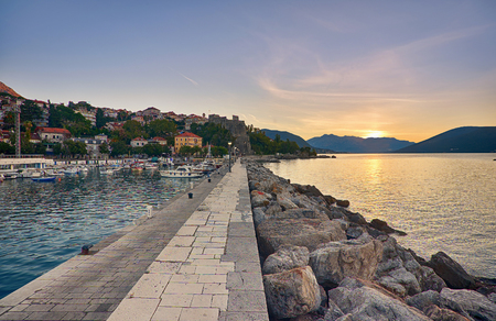 Beautiful sunset over the sea in Herceg Novi town in Montenegroの写真素材