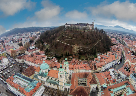 Aerial view of castle in Ljubljana, Slovenia surrouded by buildingsのeditorial素材
