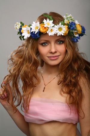 girl with a wreath of flowers on her headの写真素材