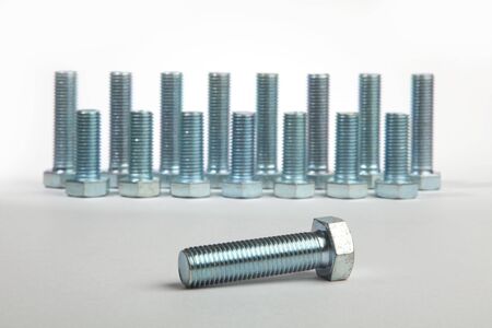 brilliant bolts of various sizes on a white backgroundの写真素材