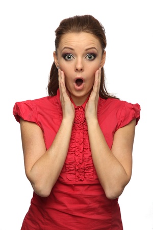 pretty girl in a red blouse very surprised (white background)の写真素材