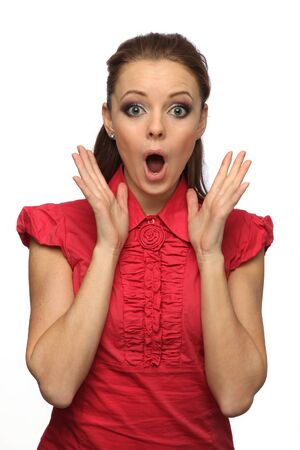 pretty girl in a red blouse very surprised (white background)の写真素材