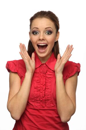 pretty girl in a red blouse very surprised (white background)の写真素材