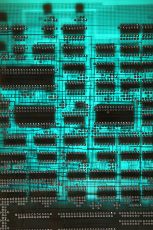 Dirty old printed circuit board with computer chipsの写真素材