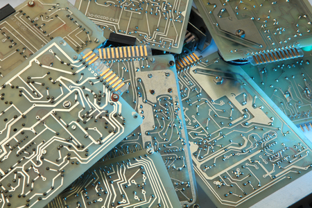 Dirty old printed circuit board with computer chipsの写真素材