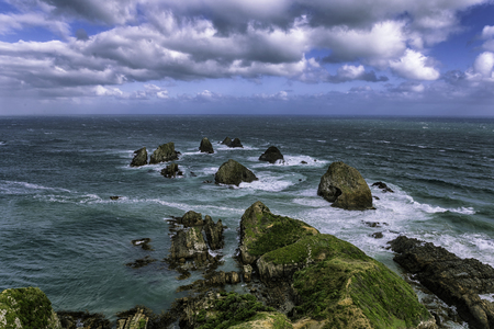 Nugget Point rock in the ocean in Otago, New Zealand