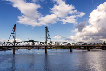Hawthorne Bridge - a truss bridge with a vertical lift that spans the Willamette River in Portland, Oregonの写真素材