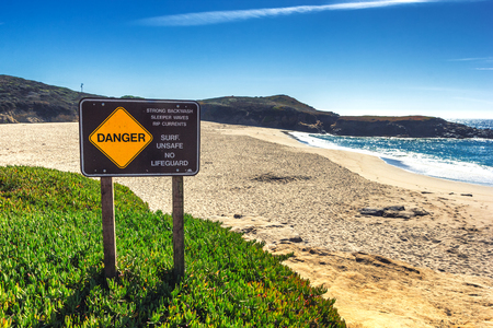 Warning danger sign for surfers in California, USAの写真素材