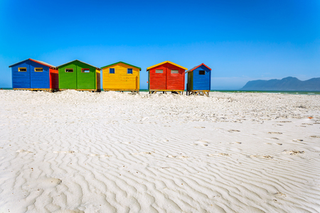 Muizenberg beach with white sand and colorful wooden cabins in Cape Town, South Africaの写真素材
