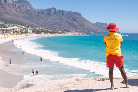 Cape Town lifeguard watching famous Camps Bay beach with turquoise waterの写真素材