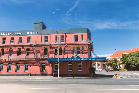 DUNEDIN, NEW ZEALAND - DECEMBER, 2018: Old red hotel building in Dunedin cityのeditorial素材