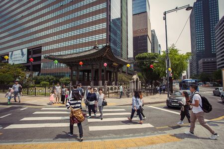 SEOUL, SOUTH KOREA - MAY, 2017: Pedestrians crossing busy street in Seoul downtownのeditorial素材
