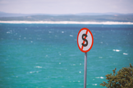 Prohibited stopping sign and ocean background in South Africaの写真素材