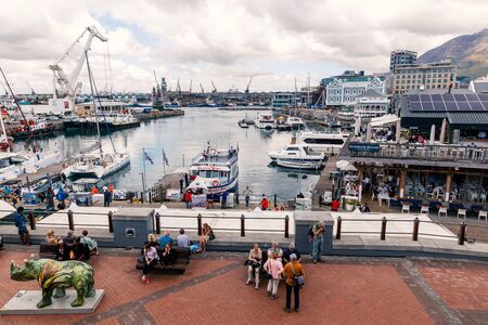 CAPE TOWN, SOUTH AFRICA - NOVEMBER, 2018: Waterfront area view with yachts, tourists, restaurants and shops in Cape Townのeditorial素材