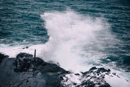 Stormy weather with big waves at rocky coastline of Oahu island, Hawaiiの写真素材