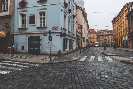 PRAGUE, CZECH REPUBLIC - OCTOBER, 2019: Old streets of Prague historical center with bars and shopsのeditorial素材