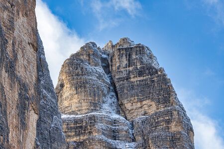 Close up view of gorgeous rocky mountains partly covered with snow in Dolomites, Italyの写真素材