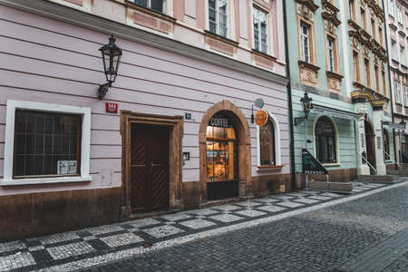 PRAGUE, CZECH REPUBLIC - OCTOBER, 2019: Old streets of Prague historical center with bars and shops