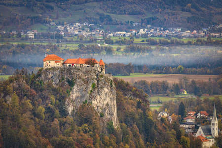 Aerial view of Bled castle on the rock on the bank of Lake Bled, famous touristic destination in Sloveniaのeditorial素材