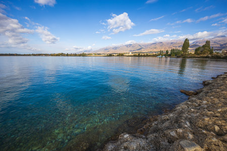 Beautiful coastline of Issyk-Kul lake - famous touristic destination in Kyrgyzstanの写真素材