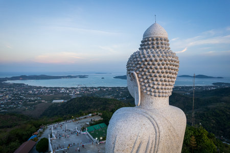 Famous white Big Buddha statue on the top of the hill in Phuket, aerial sunset viewの写真素材