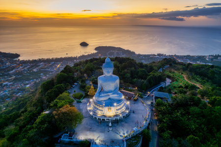 Famous white Big Buddha statue on the top of the hill in Phuket, aerial sunset viewの写真素材