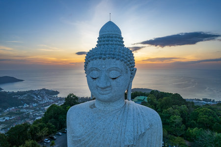 Famous white Big Buddha statue on the top of the hill in Phuket, aerial sunset viewの写真素材