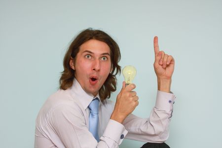 business man with a lamp on white backgroundの写真素材