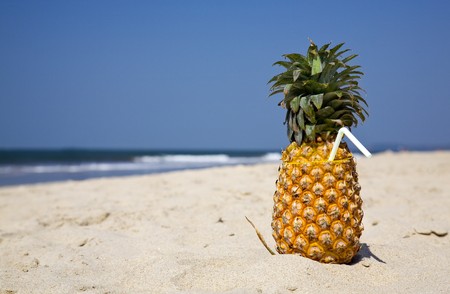 fruity cocktail on the beach sand. place fot textの写真素材