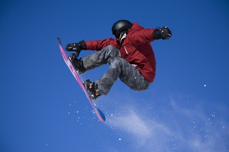 snowboarder jumping high in the air snowboarder jumping high in the air
