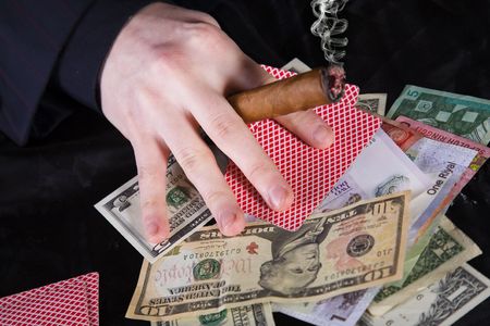 picture of poker player with cigar and different banknotesのeditorial素材