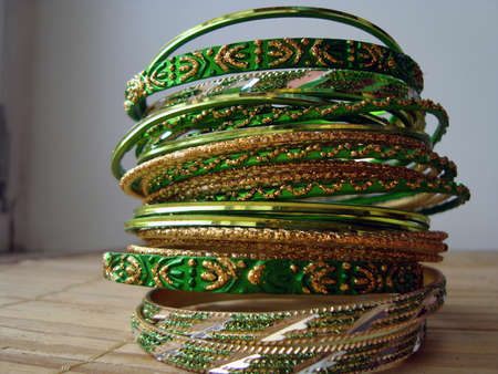 a stack of bracelets made of brassの写真素材