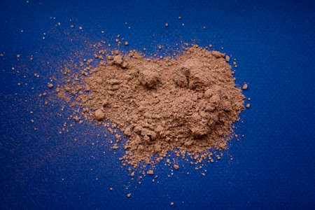 cocoa powder on a blue background