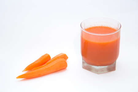carrots and carrot juice in a glassの写真素材