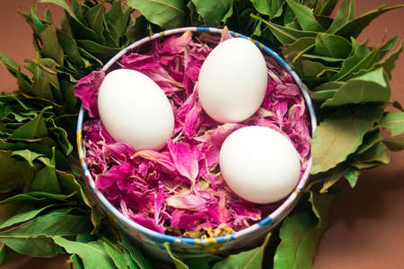 Easter card : eggs in a metal box with leaves peony and a wreath of Laurel