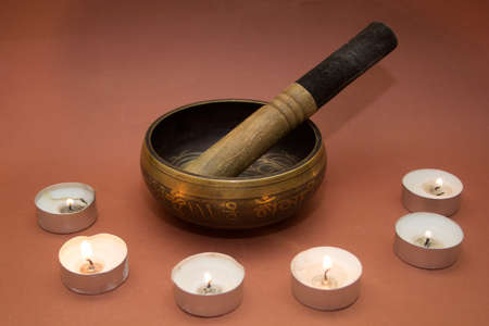 Tibetian Singing bowl with candlesの写真素材