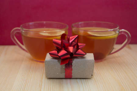 tea mugs with tea and giftsの写真素材