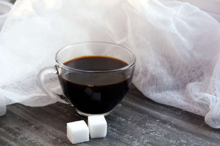 morning black coffee with sugar cubes, soft focus, natural lightの写真素材