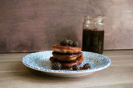 homemade chocolate pancakes served with pine cones jamの写真素材