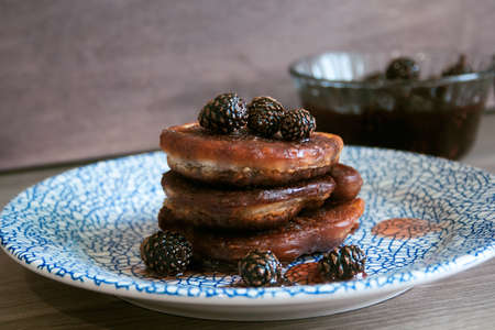 homemade chocolate pancakes served with pine cones jamの写真素材