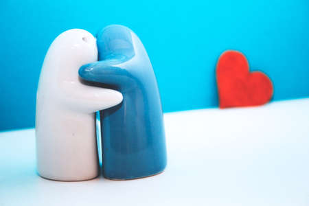 ceramic figurine with arms. Valentine's day concept.の写真素材
