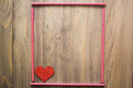 mock up background with cocktail straws and a heart on wooden backgroundの写真素材