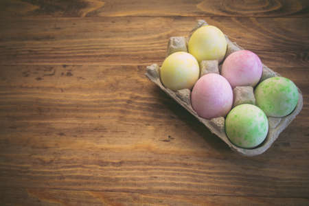 Easter eggs on a wooden tableの写真素材