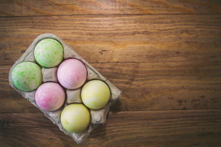 Easter eggs on a wooden tableの写真素材