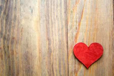 background with heart on wooden tableの写真素材