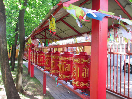 Religious prayer wheel in front of the Datsanの写真素材