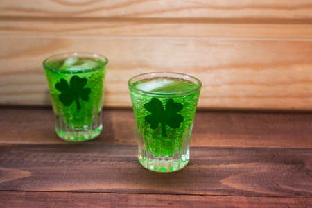 green cocktail on St. Patrick's day on a wooden backgroundの写真素材