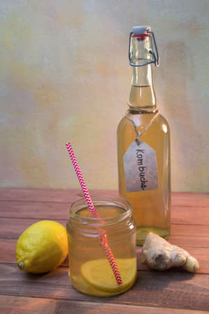 Vintage bottle and jar with Kombucha tea with lemon and gingerの写真素材