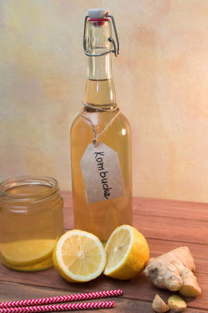 Vintage bottle and jar with Kombucha tea with lemon and gingerの写真素材