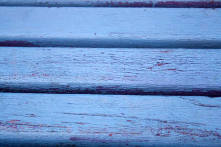 texture of old wooden planks painted in blue and purpleの写真素材